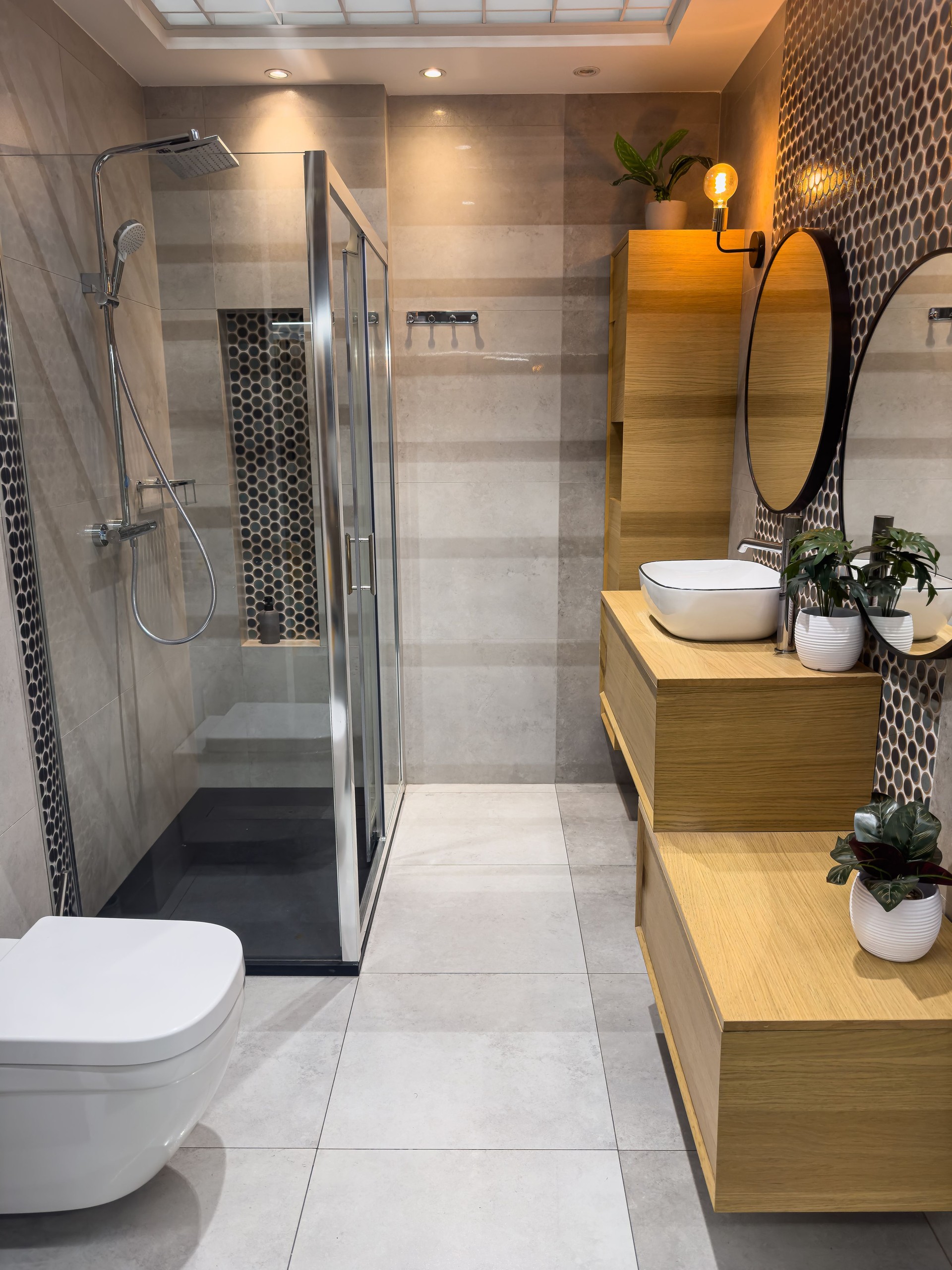 Stylish bathroom interior design with glass shower. Modern restroom in home
